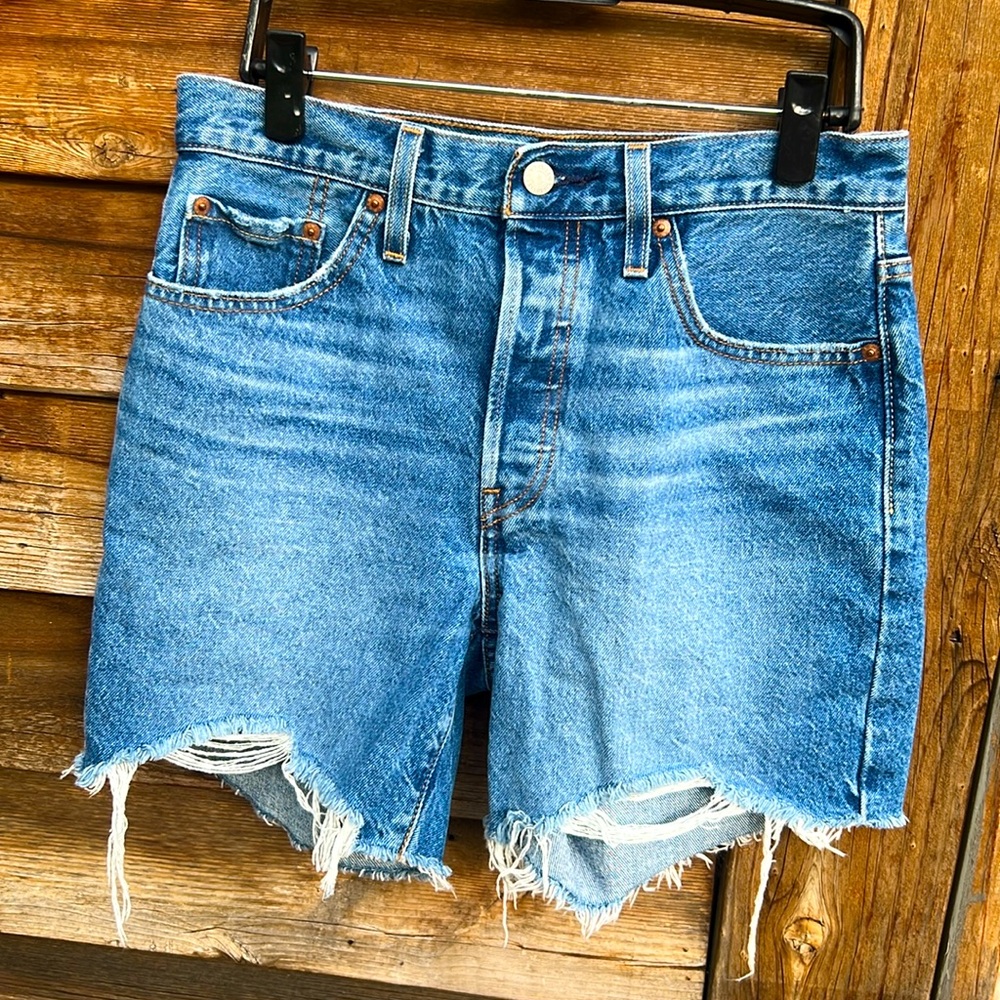 Levi’s 501 distressed Raw hem button fly cutoff jeans
